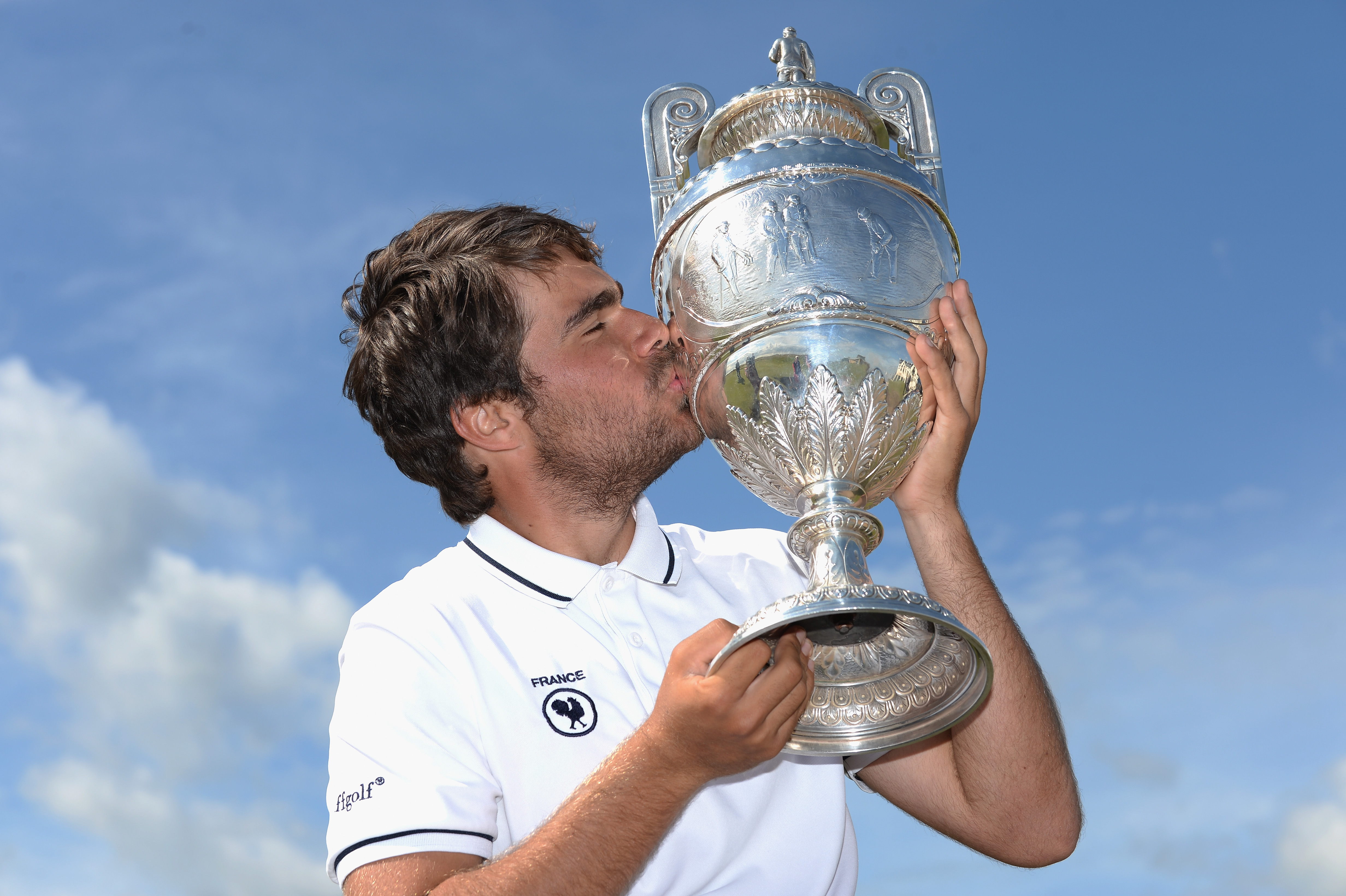 CARNOUSTIE, SCOTLAND - JUNE 20:  Romain Langasque of France poses with The Amateur Championship Trophy after winning the Final of The Amateur Championship 2015 - Day Six at Carnoustie Golf Club on June 20, 2015 in Carnoustie, Scotland.  (Photo by Tony Marshall/R&A/R&A via Getty Images)